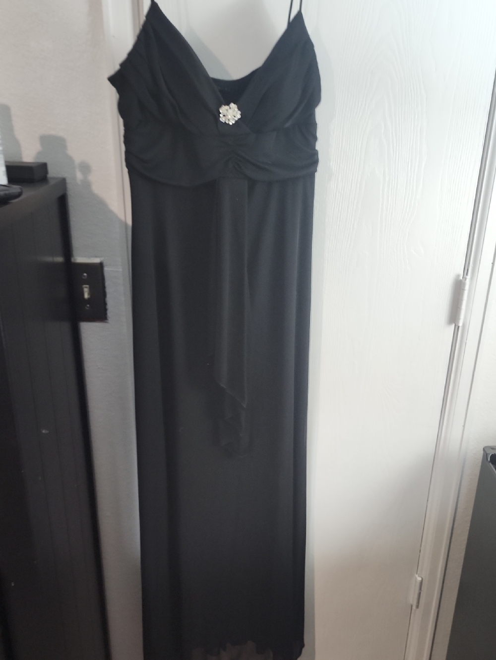 B. Smart Black Spaghetti-Strap Maxi Dress with Rhinestone Brooch
